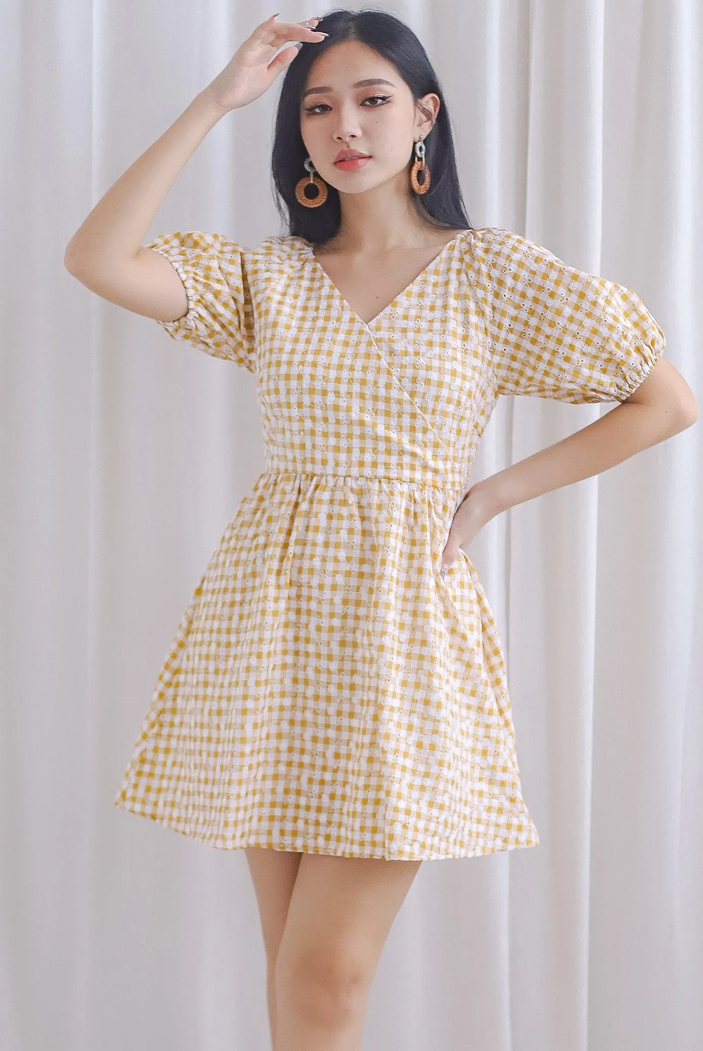 Evvie Gingham Embro Faux Wrap Romper In Yellow