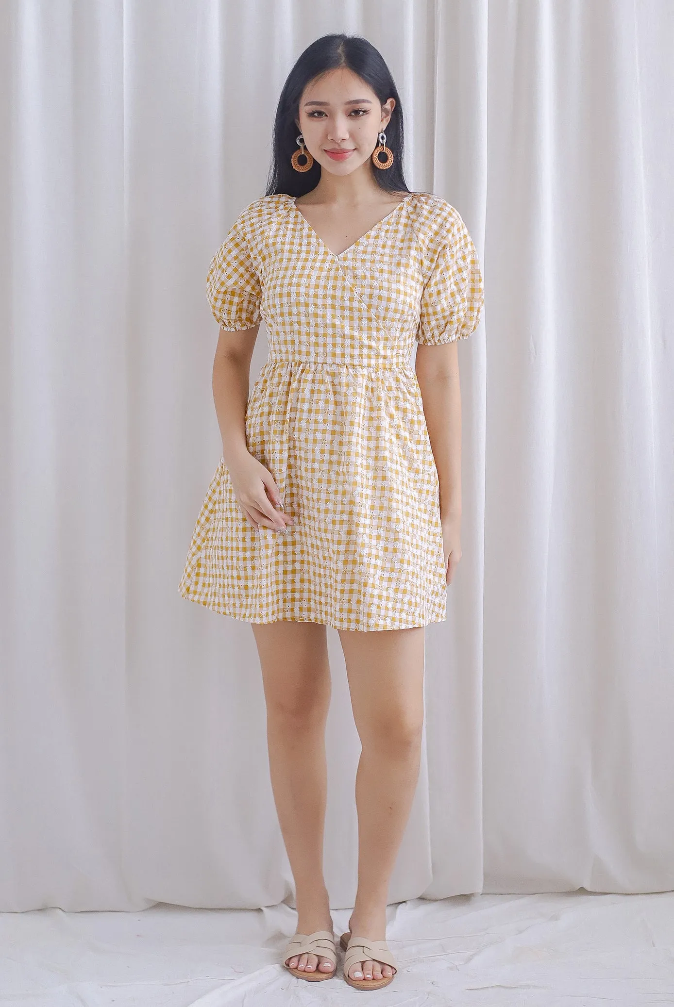 Evvie Gingham Embro Faux Wrap Romper In Yellow
